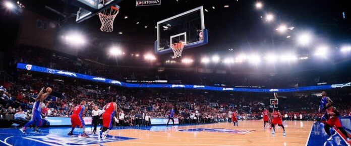 A basketball game in progress, with players on the court and spectators in the stands.