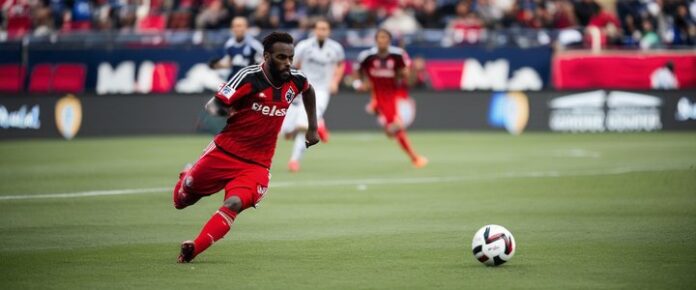 Patrick Agyemang scoring a goal during a soccer match.