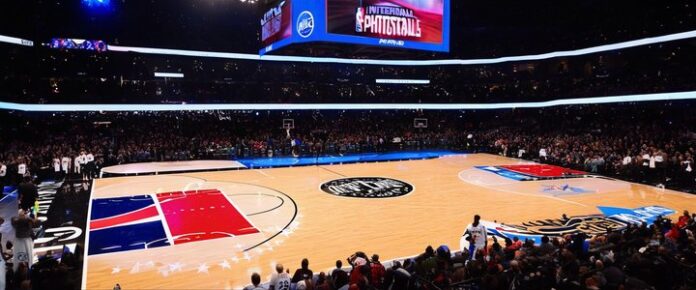 Poker players competing at a tournament table with cards and chips.