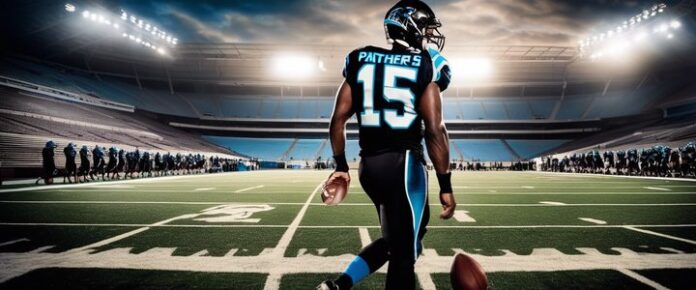 Two football players in black uniforms walk on a football field in a stadium.