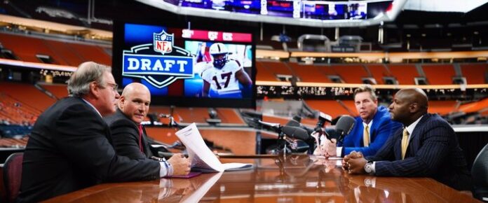 Coaches analyzing NFL draft prospects at a poker event table.