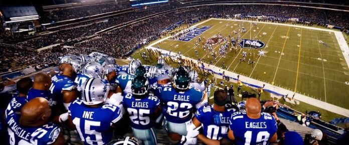 Cowboys and Eagles players clash on the football field during a game.
