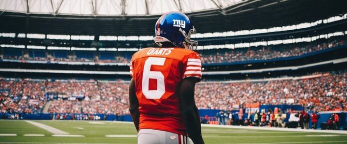 Giants' draft pick Carter holds up jersey with number 51.