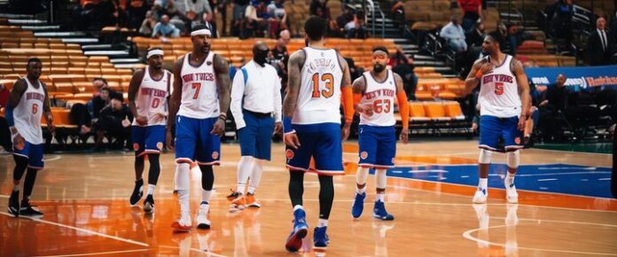 Jalen Brunson teasing Josh Hart about NCAA title win.