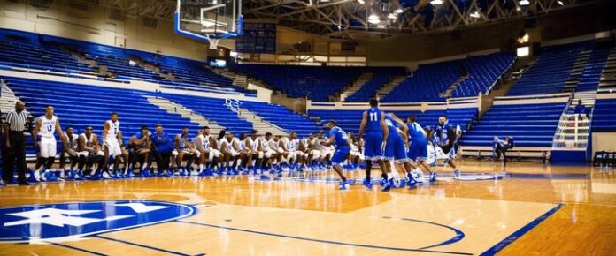 Mark Pope coaching Kentucky basketball team during a game.