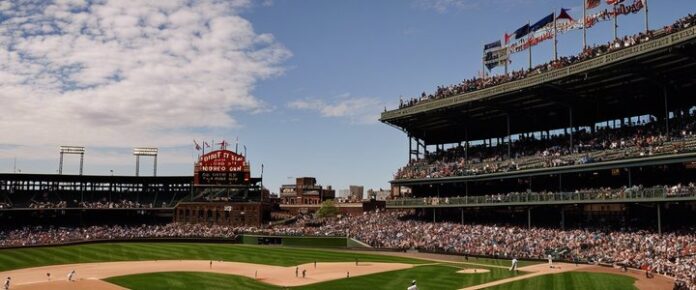 Poker players competing at a crowded tournament table.