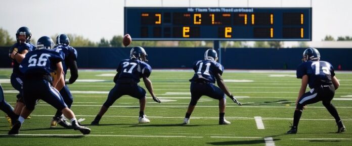 Stefanski watches Gabriel take quarterback reps during practice.